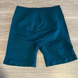 Aurola intensify workout shorts. Color: Deep Teal